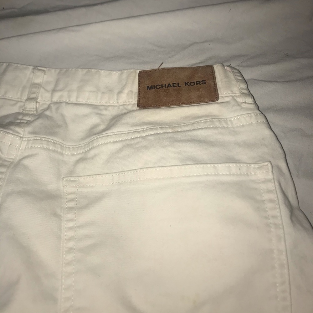 White MK pants.